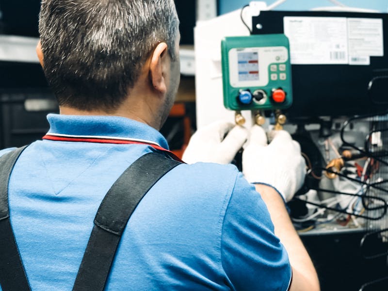 Indoor HVAC system maintenance and heating installation by certified technician